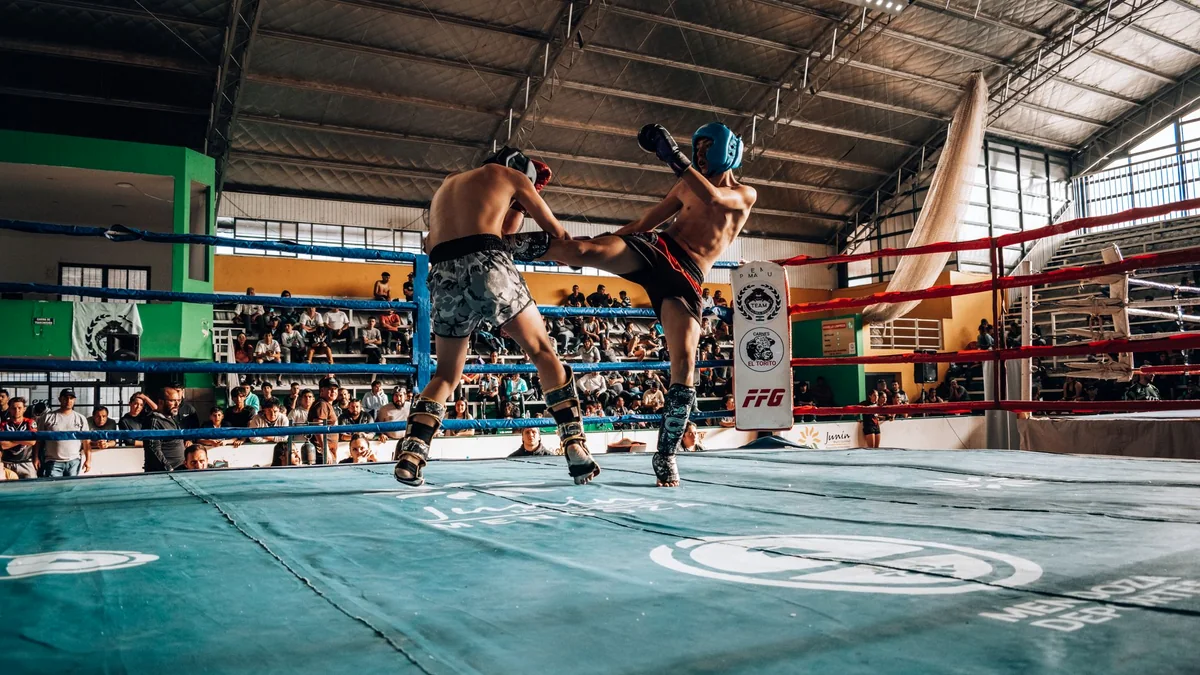 Illustrative kickboxing championship match in a crowded indoor arena