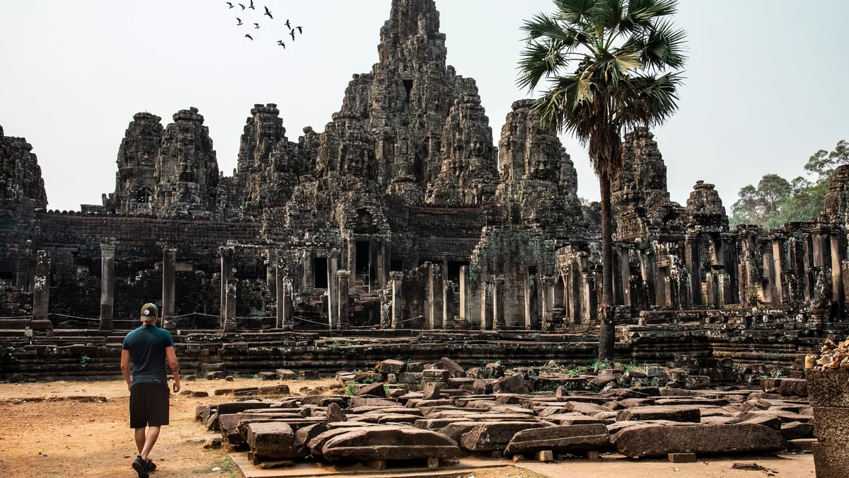 Illustrative visitor exploring the ancient Bayon Temple in Siem Reap